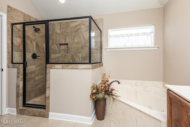 3289 Marion Ln, Southaven, MS 38672 - bathroom featuring a jetted tub, a stall shower, vanity, vaulted ceiling, and tile patterned flooring