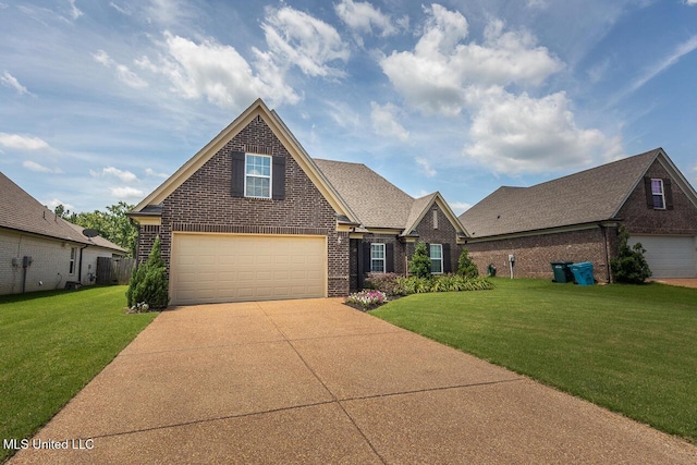 3289 Marion Ln, Southaven, MS 38672 - traditional-style home featuring brick siding, driveway, a front lawn, and a garage
