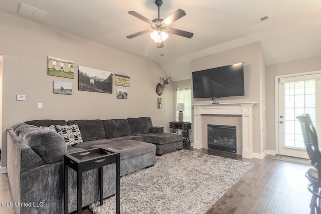 3289 Marion Ln, Southaven, MS 38672 - living area with ceiling fan, a tile fireplace, wood finished floors, plenty of natural light, and vaulted ceiling
