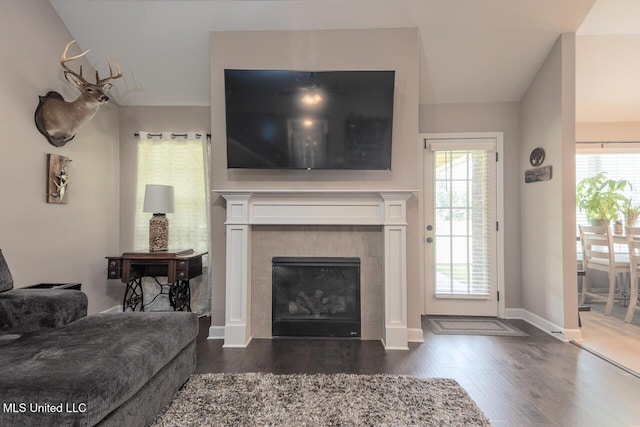 3289 Marion Ln, Southaven, MS 38672 - living room featuring dark wood-type flooring, a tile fireplace, and plenty of natural light