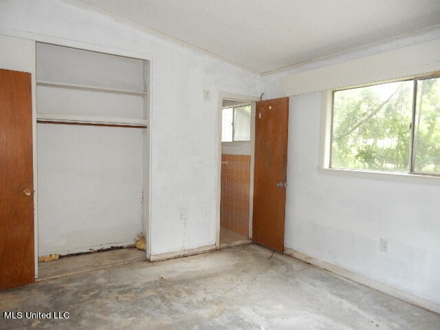 unfurnished bedroom featuring a closet