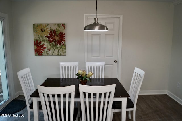 dining space featuring dark hardwood / wood-style floors