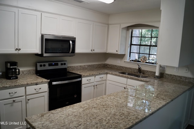 kitchen with black electric range oven, ornamental molding, sink, light stone countertops, and white cabinets