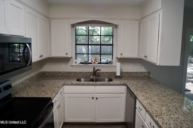 kitchen with white cabinetry, appliances with stainless steel finishes, and sink