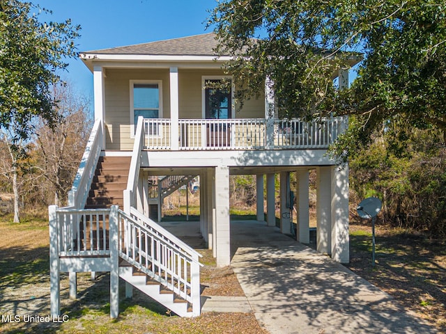 view of front of home featuring a carport and covered porch