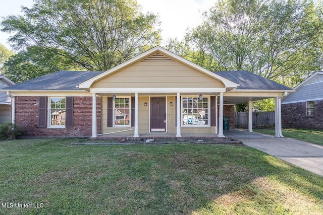 view of front of home featuring concrete driveway, brick siding, fence, and a front yard
