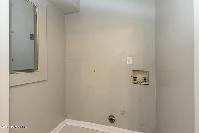 clothes washing area with electric panel, baseboards, washer hookup, hookup for a gas dryer, and laundry area