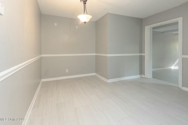 empty room with baseboards