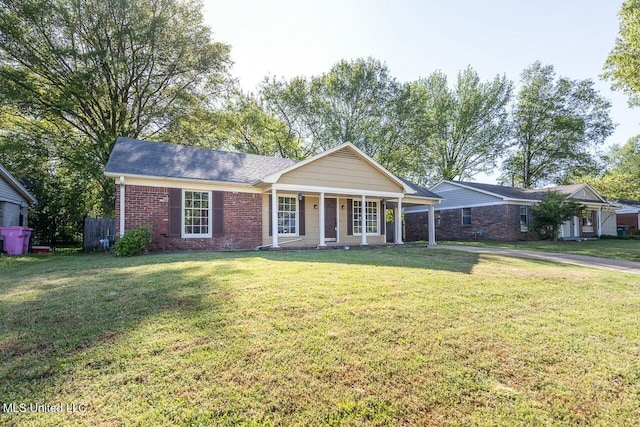 single story home featuring a front lawn, brick siding, and a porch