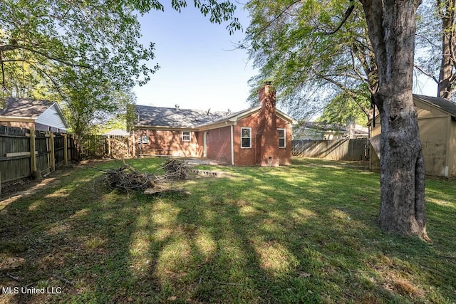 view of yard with a fenced backyard