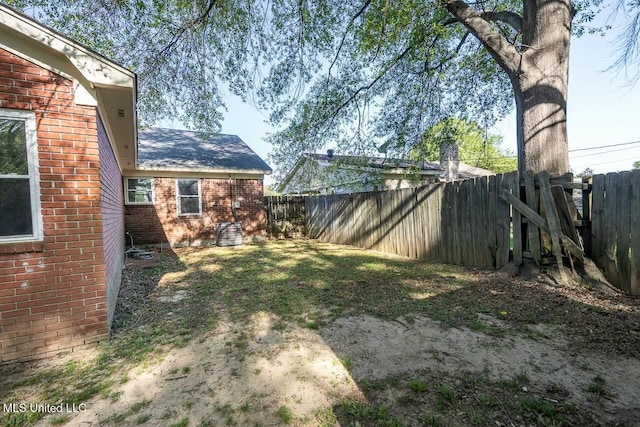 view of yard with a fenced backyard