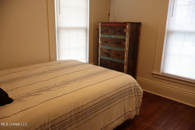 bedroom featuring dark wood-type flooring