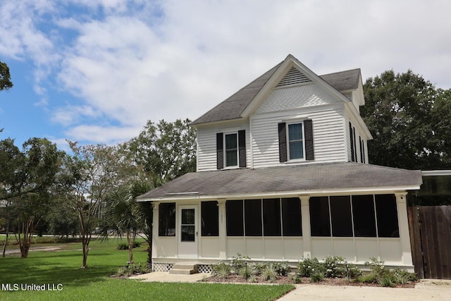 1009 Resca De La Palma St, Pascagoula, MS 39567 - rear view of house with a sunroom and roof with shingles