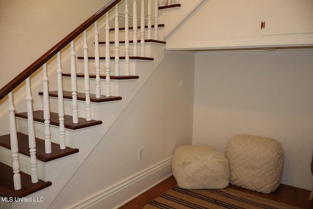 1009 Resca De La Palma St, Pascagoula, MS 39567 - staircase featuring wood finished floors and baseboards