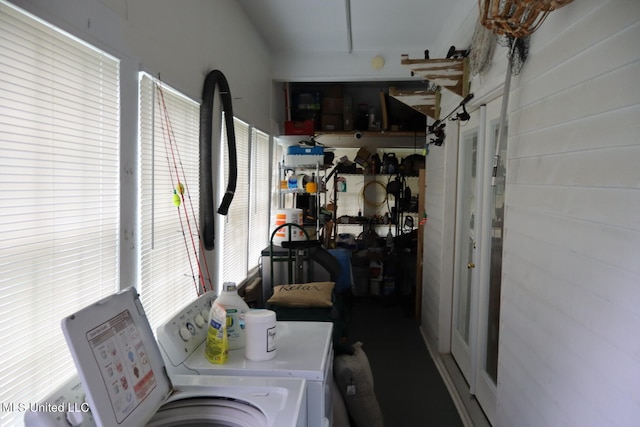 laundry area featuring plenty of natural light and washing machine and clothes dryer