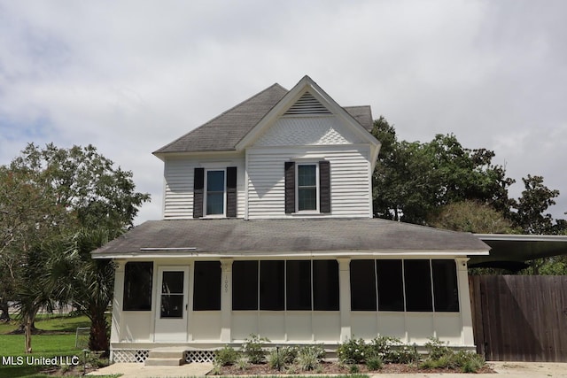 1009 Resca De La Palma St, Pascagoula, MS 39567 - view of front facade with a sunroom and roof with shingles