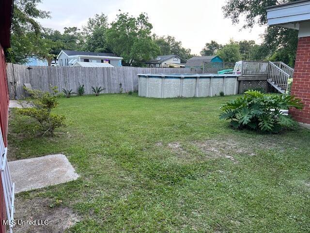 204 E Third St, Long Beach, MS 39560 - view of yard with a deck and stairs