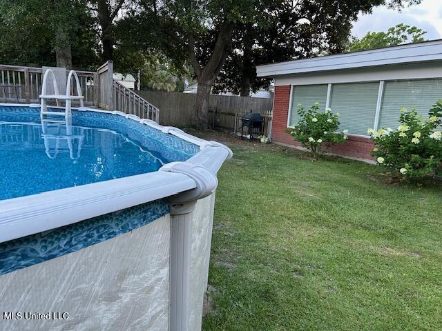204 E Third St, Long Beach, MS 39560 - view of swimming pool featuring grilling area