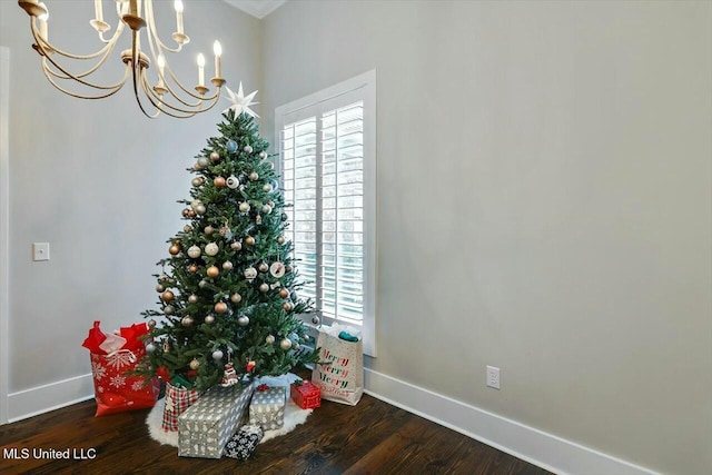 interior space featuring an inviting chandelier and hardwood / wood-style flooring