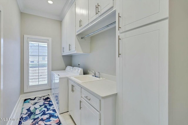 laundry area with sink, cabinets, crown molding, washer and clothes dryer, and light tile patterned floors