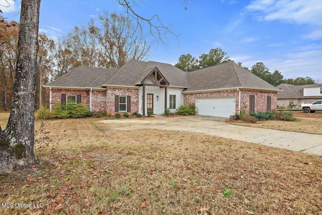 view of front of house with a garage and a front lawn