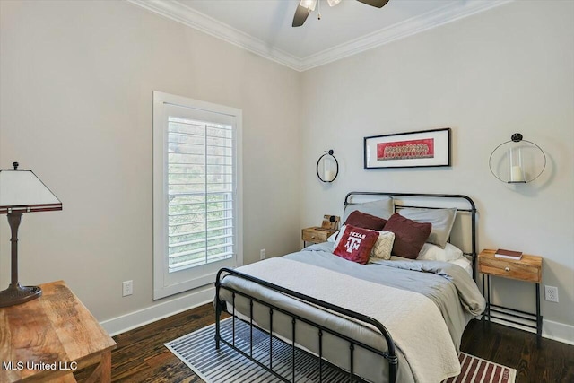 bedroom featuring ceiling fan, dark hardwood / wood-style floors, and ornamental molding