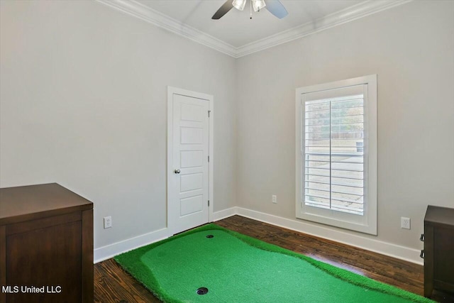 game room featuring dark hardwood / wood-style floors, ceiling fan, and ornamental molding