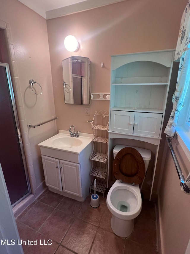 bathroom featuring vanity, toilet, tile patterned flooring, and a shower with shower curtain