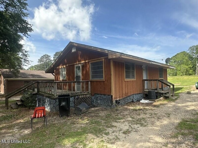 221 N W St, Mendenhall, MS 39114 - view of home's exterior with central air condition unit and a wooden deck