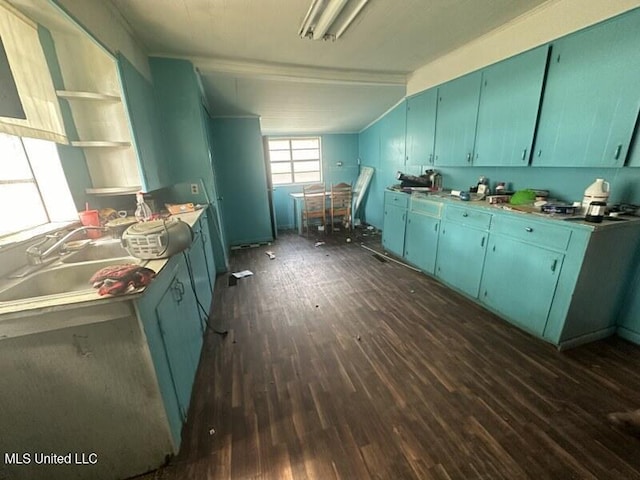 221 N W St, Mendenhall, MS 39114 - kitchen with dark wood-style flooring, lofted ceiling, a sink, blue cabinetry, and open shelves