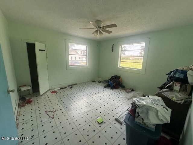 221 N W St, Mendenhall, MS 39114 - unfurnished bedroom featuring a textured ceiling, a ceiling fan, and light floors