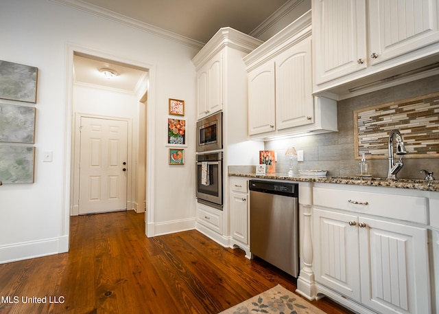 124 Westerly Pl, Madison, MS 39110 - kitchen featuring stainless steel appliances, dark stone countertops, baseboards, tasteful backsplash, and a sink