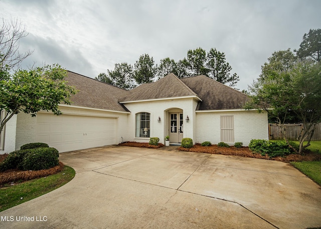 124 Westerly Pl, Madison, MS 39110 - view of front of home featuring a garage, concrete driveway, roof with shingles, and stucco siding