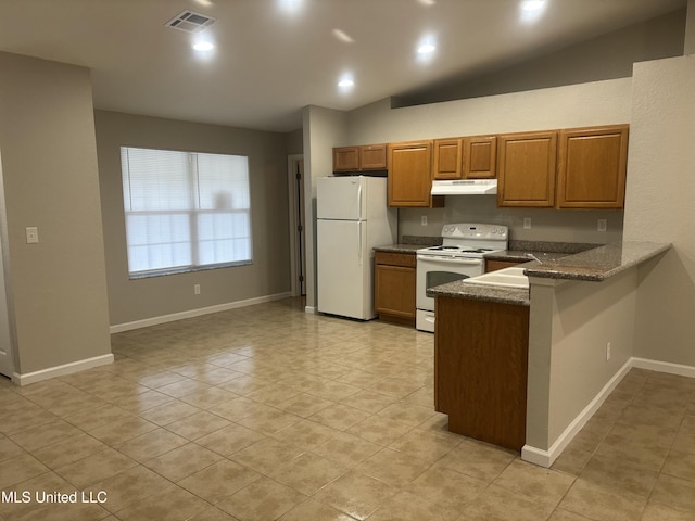 kitchen with visible vents, under cabinet range hood, white appliances, a peninsula, and brown cabinetry