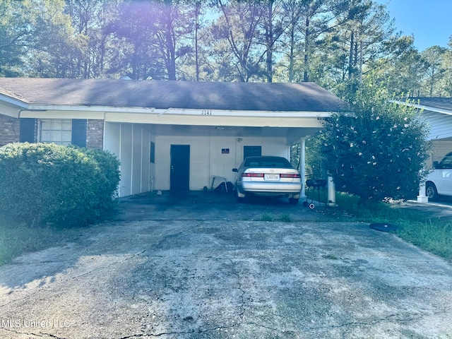 view of side of home featuring a carport