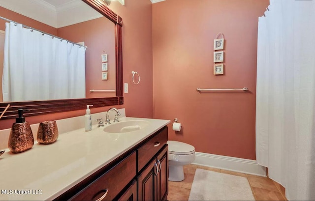 full bathroom featuring toilet, ornamental molding, vanity, tile patterned flooring, and baseboards