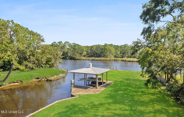 view of dock with a water view, boat lift, and a yard