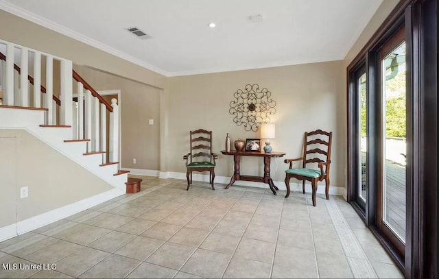 sitting room with baseboards, ornamental molding, and light tile patterned flooring