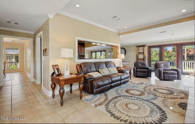 living room with baseboards, visible vents, ornamental molding, light tile patterned flooring, and recessed lighting