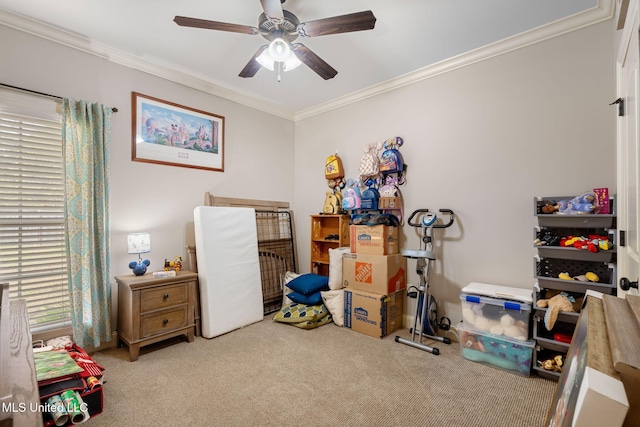 carpeted bedroom featuring ceiling fan, a crib, and ornamental molding