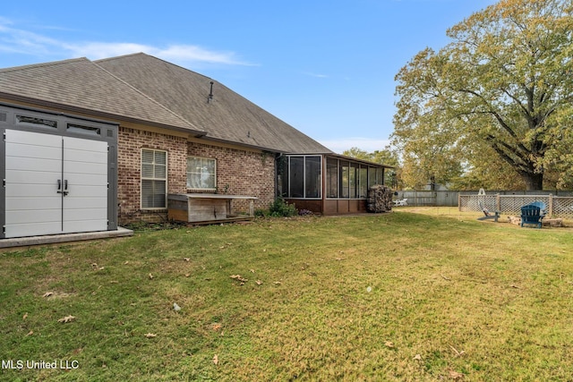 view of yard featuring a sunroom