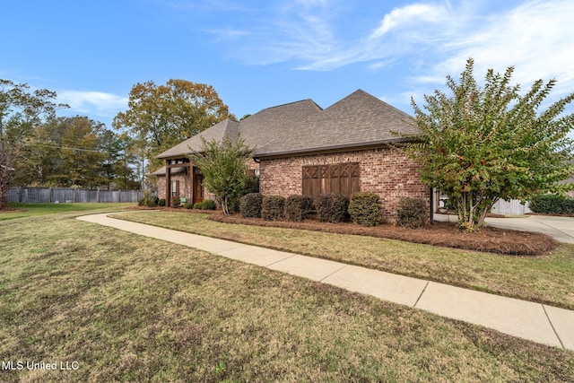 view of front of home with a front lawn