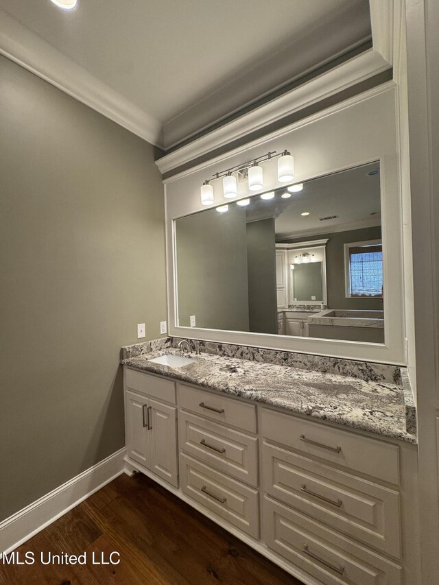402 Ironwood Pl, Madison, MS 39110 - bathroom featuring baseboards, ornamental molding, vanity, and wood finished floors