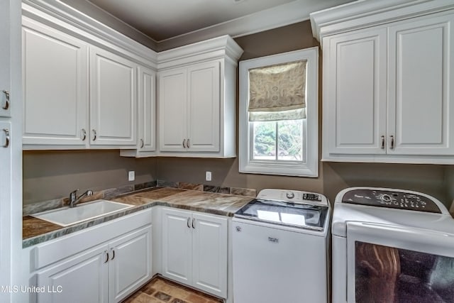 402 Ironwood Pl, Madison, MS 39110 - clothes washing area featuring washing machine and clothes dryer, a sink, and cabinet space