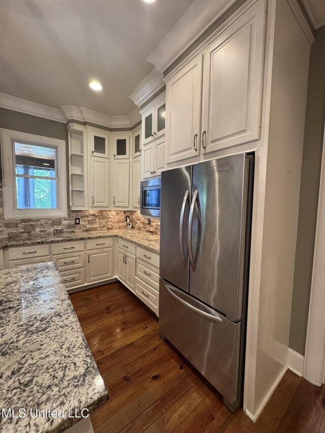 402 Ironwood Pl, Madison, MS 39110 - kitchen with white cabinetry, crown molding, dark wood finished floors, and appliances with stainless steel finishes