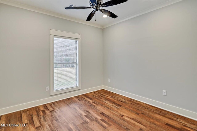 empty room featuring ceiling fan, wood-type flooring, and crown molding