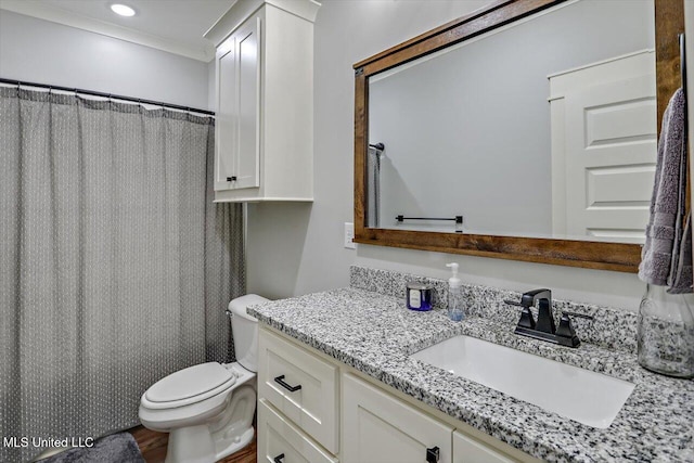 bathroom with vanity, toilet, crown molding, and curtained shower