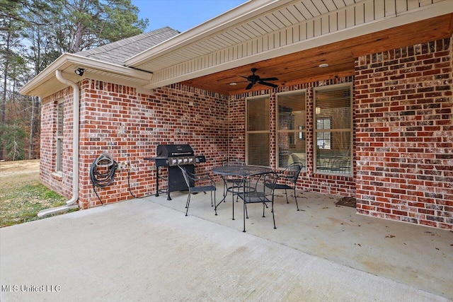 view of patio featuring ceiling fan and a grill