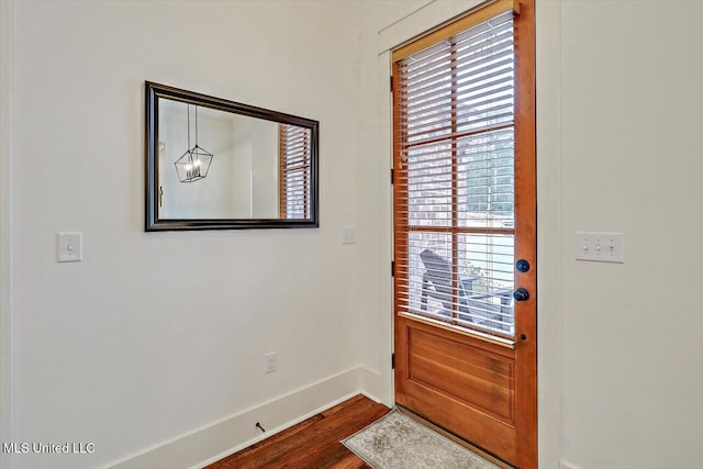 doorway to outside with hardwood / wood-style flooring