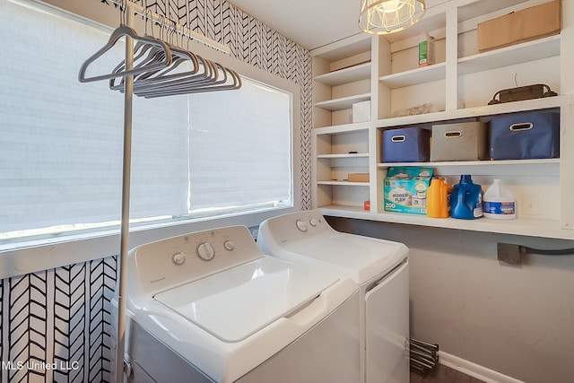 washroom featuring laundry area, independent washer and dryer, and baseboards